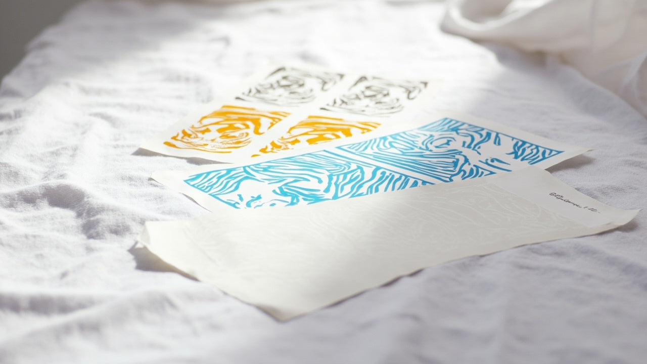 dtf transfer sheets and uv dtf stickers on clean studio tabletop